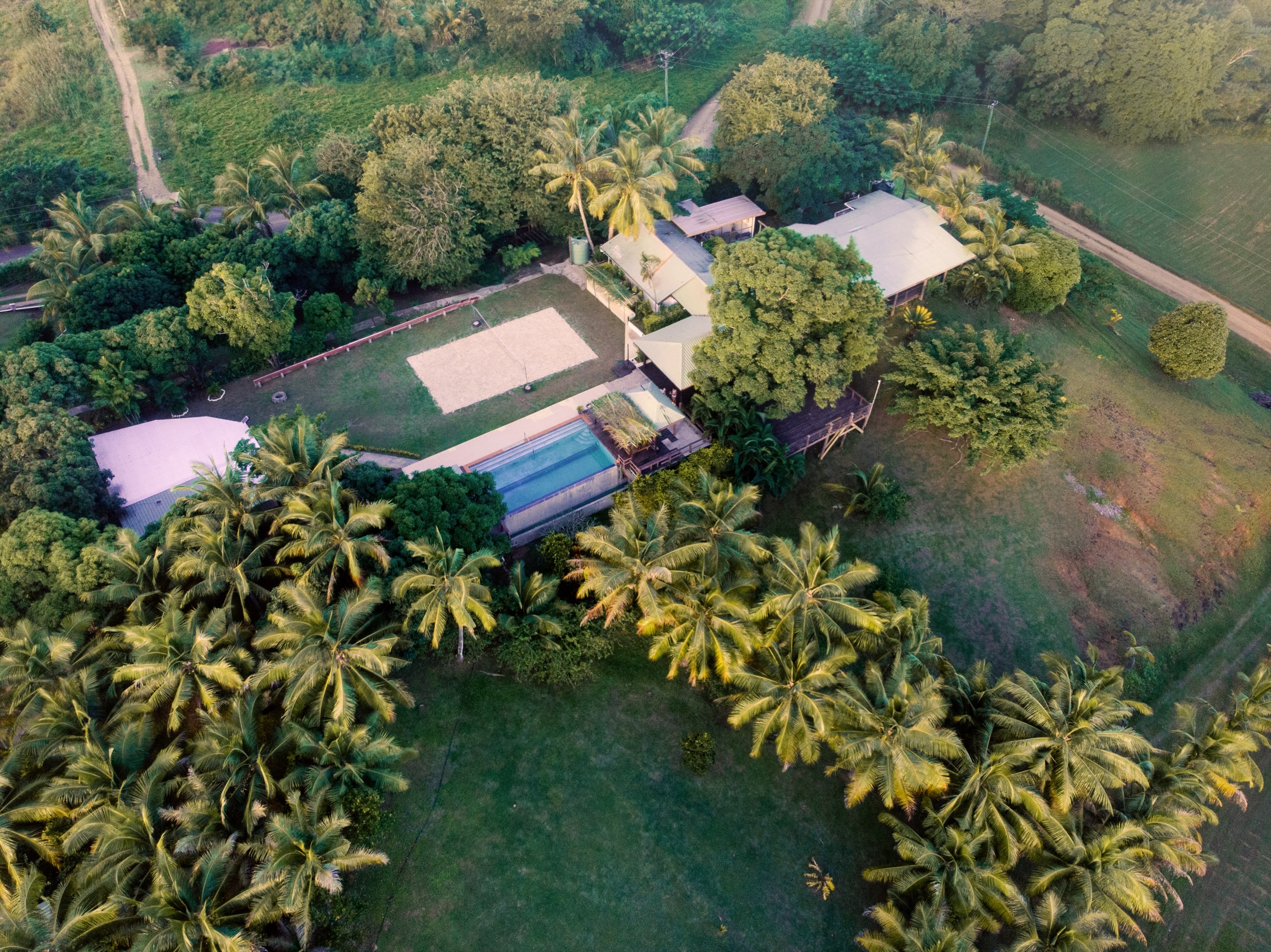 Aerial view of Fiji retreat accommodation surrounded by palms